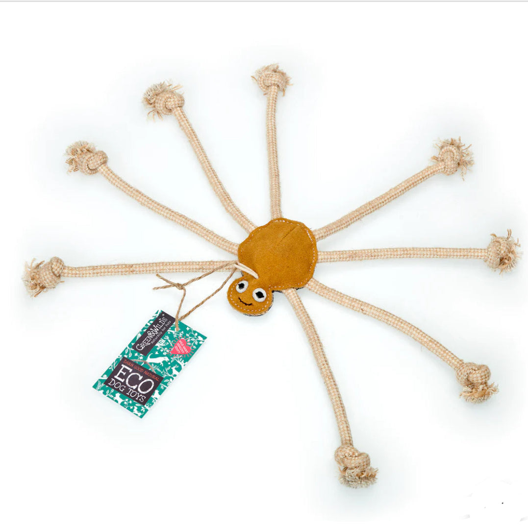A suede dog toy shaped like a spider with jute rope legs and a label that reads 'Green & Wild's Eco-toy'.