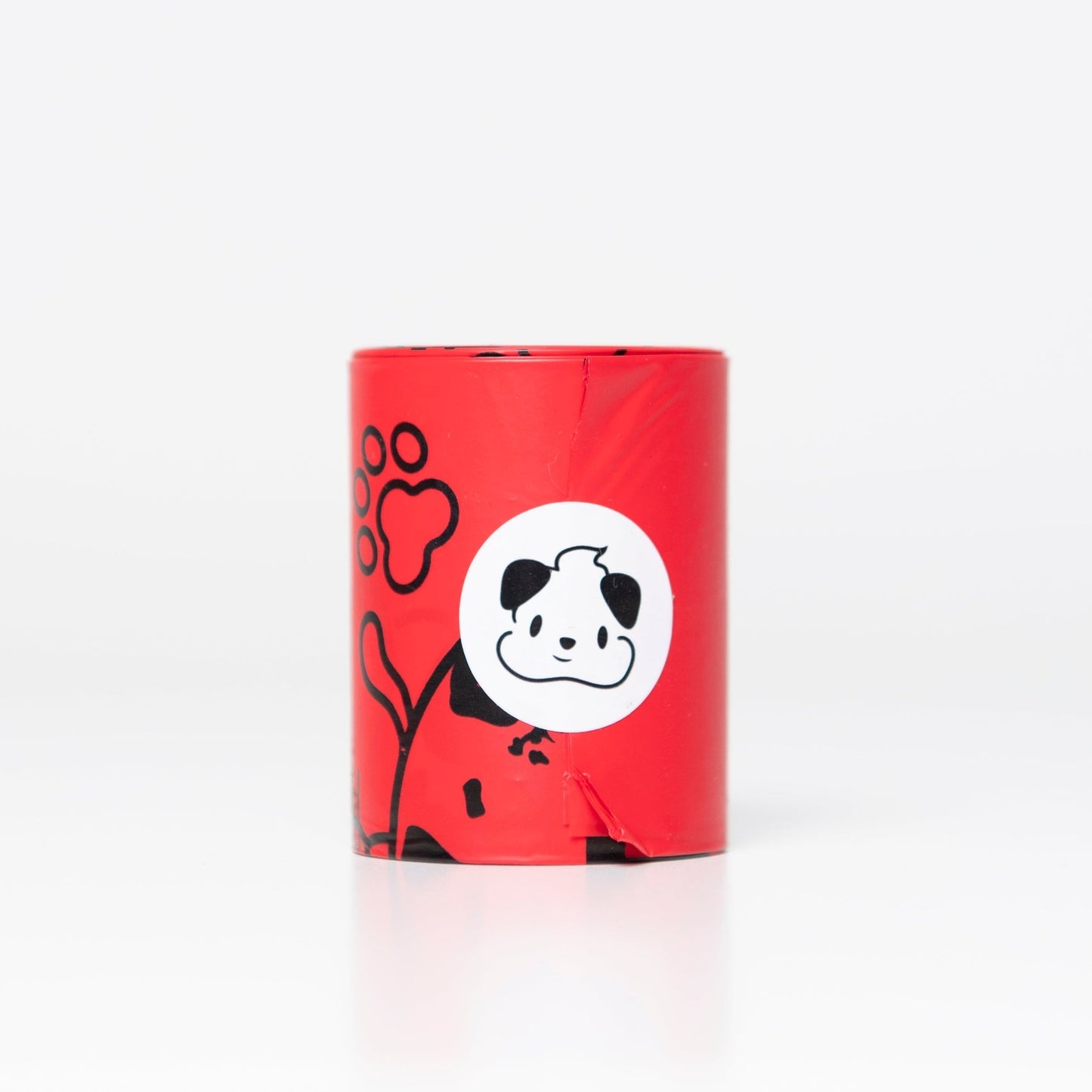 A roll of FETCH.IT mini compostable poo bags with a graphic of a dog and a paw print on a red background.