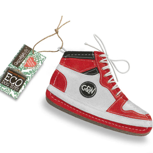 A hi-top dog toy in red, white, and black colors with a label attached that reads 'ECO TOYS'.