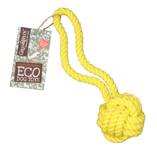 A yellow knotted jute rope ball on a white background, with packaging that reads 'Green & Wild ECO DOG TOY'.